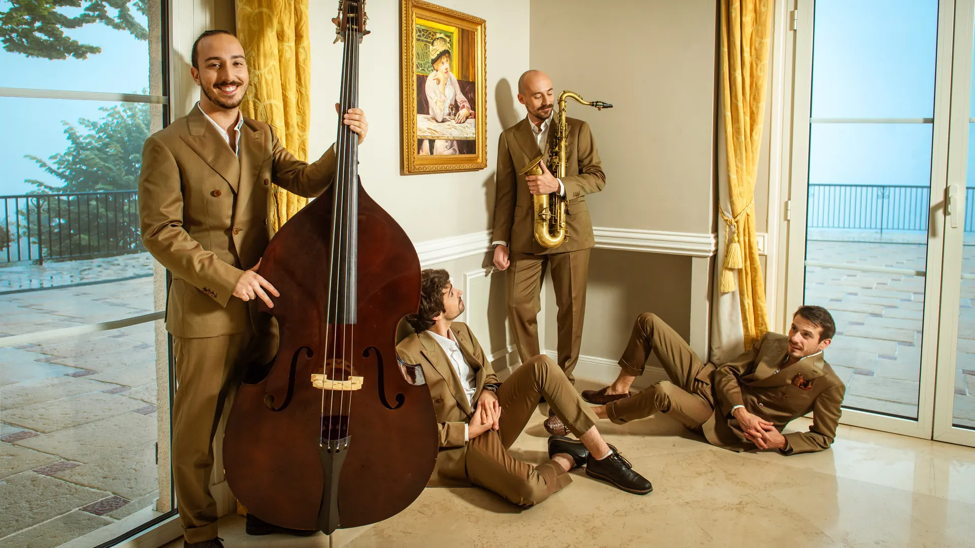 The band in a bright salon overlooking the bay of Nice