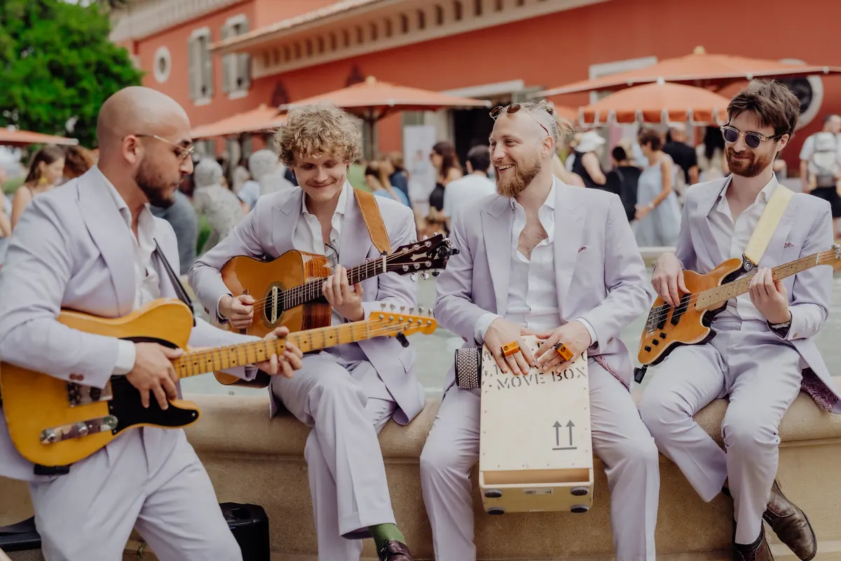 The band at a table in a Mediterranean garden