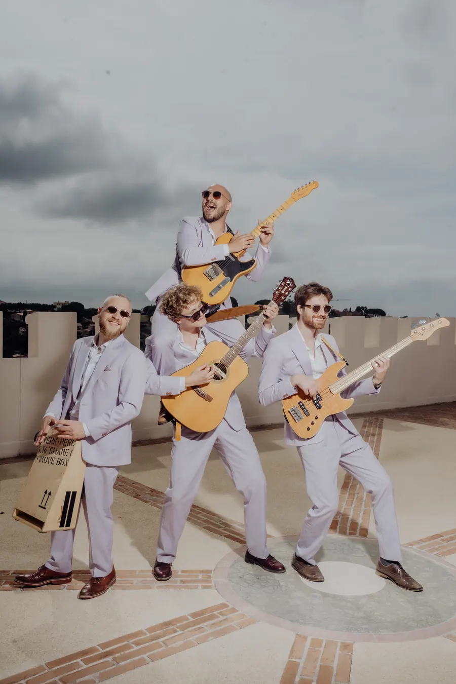 The Peppermints with their instruments on a rooftop