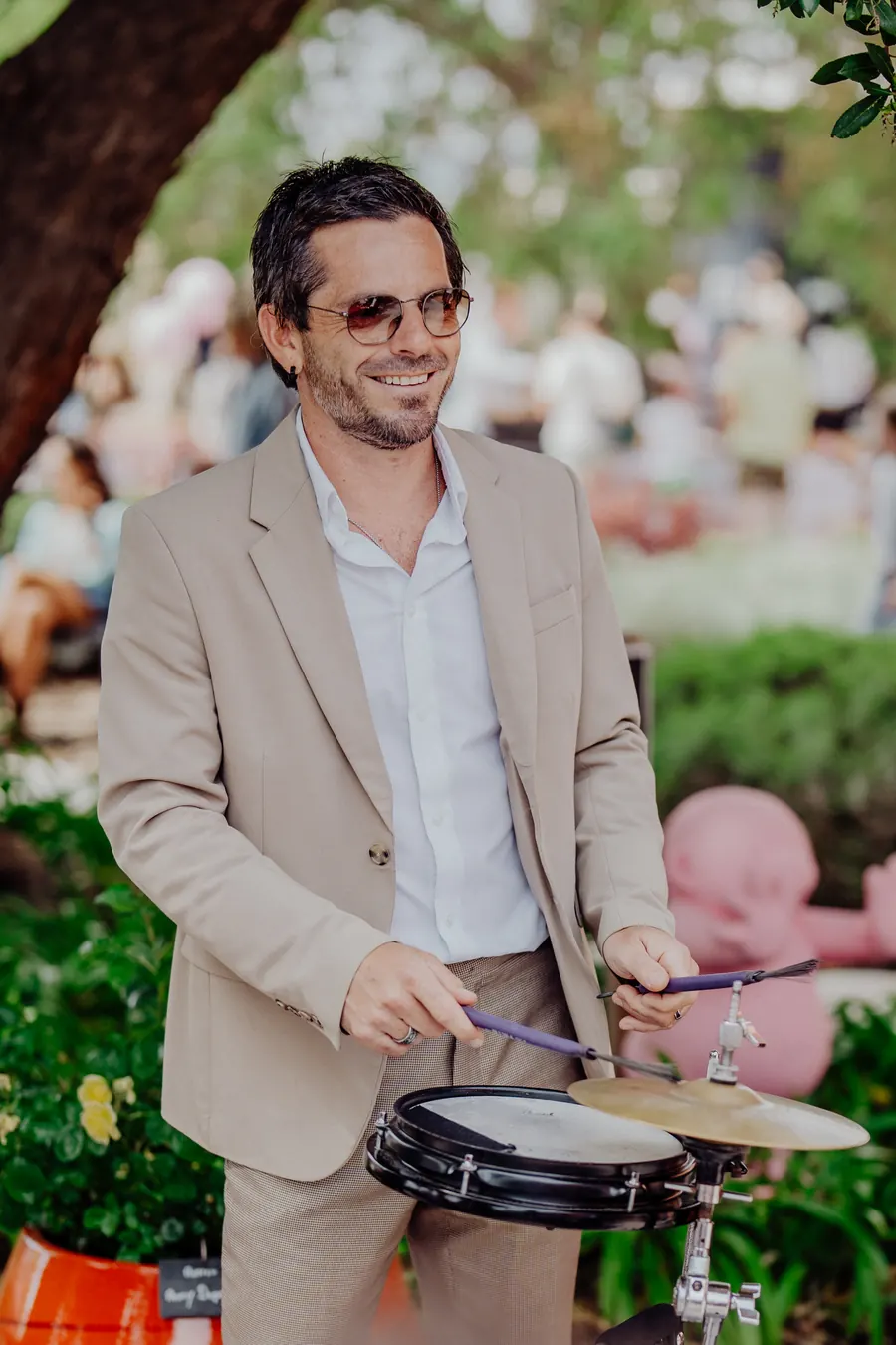 Drummer with a snare in a garden