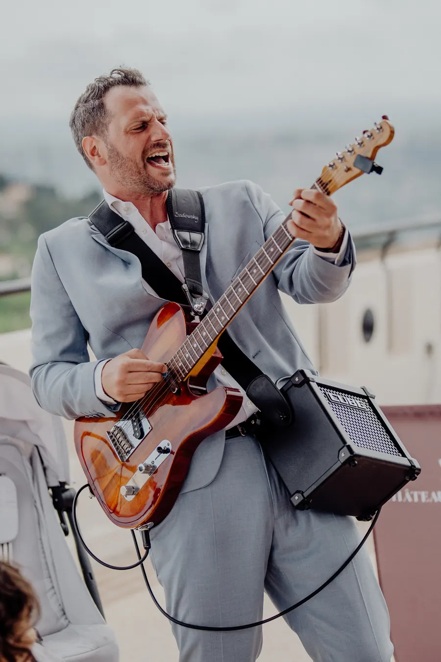 Guitarist laughing mid-song