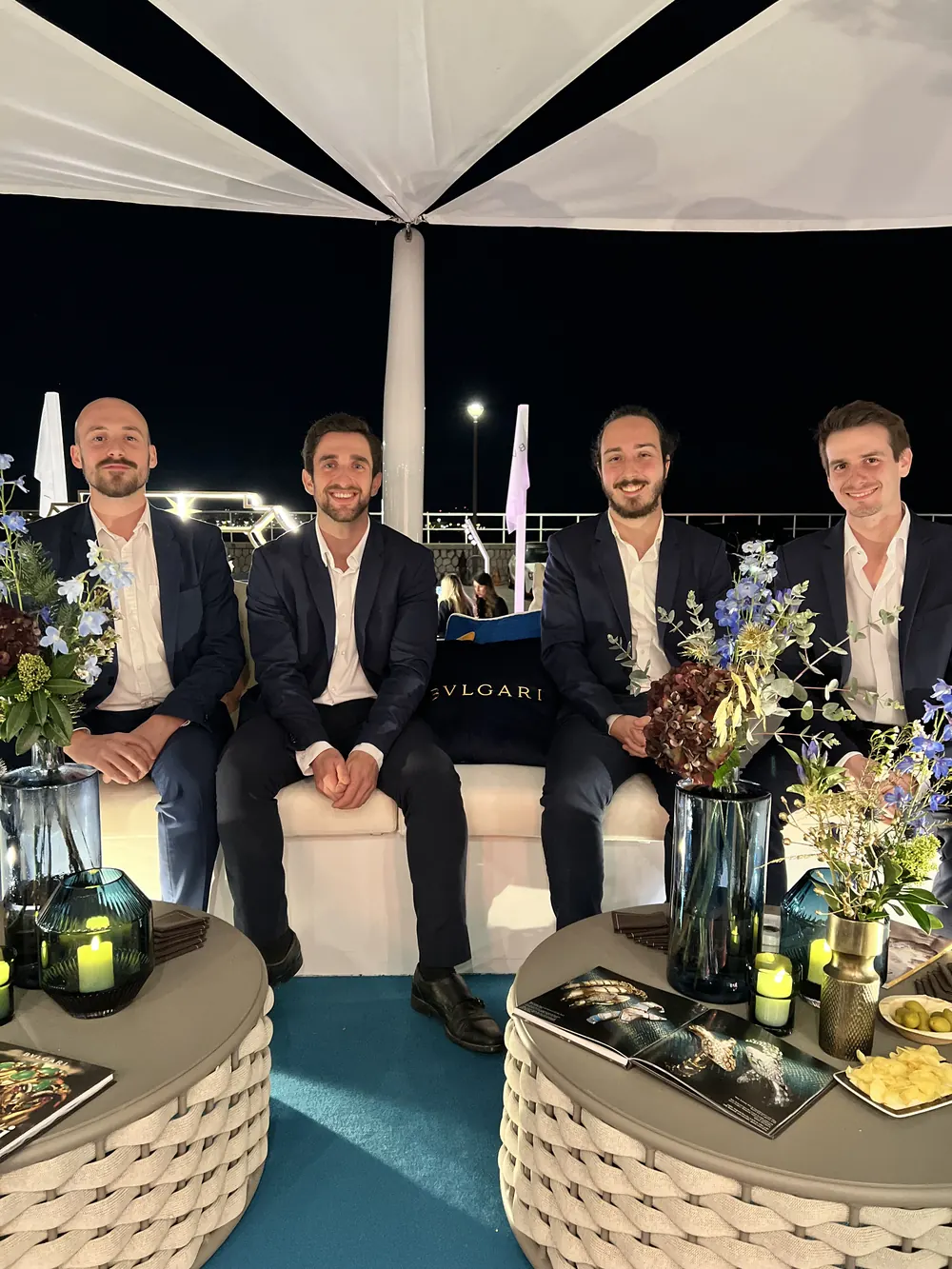 The band in a lounge at night, ready to play