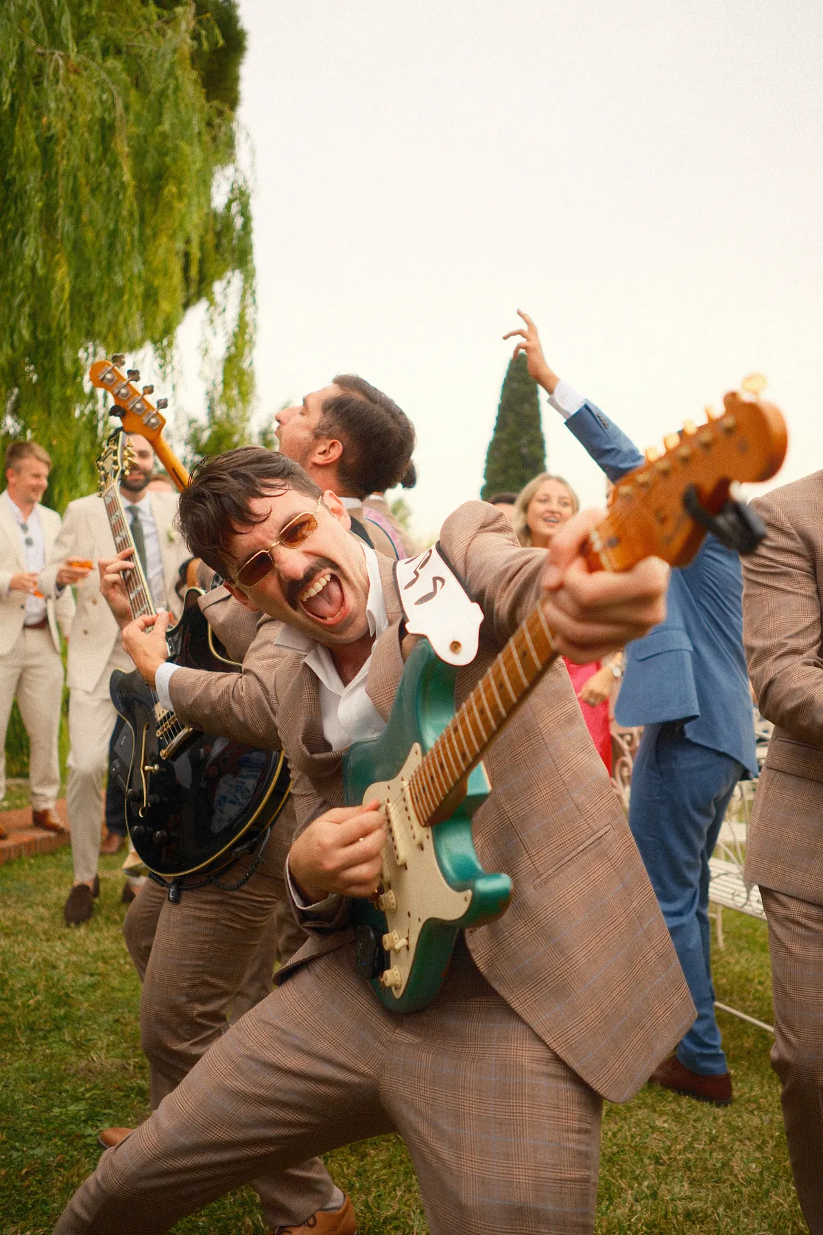 Aerial view of a guitarist on a terrace