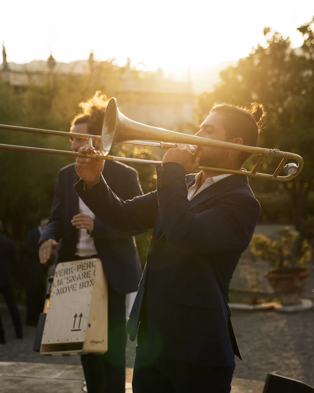 Trombonist at golden hour on a terrace
