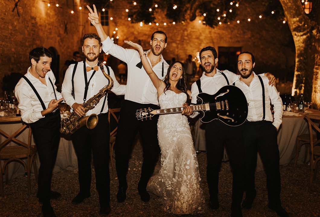 The band with the bride under the lights