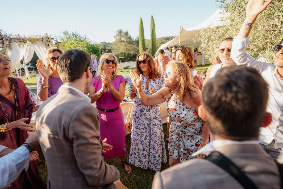 The band and guests dancing in a garden