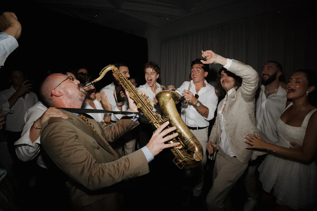 Saxophonist among the dancers