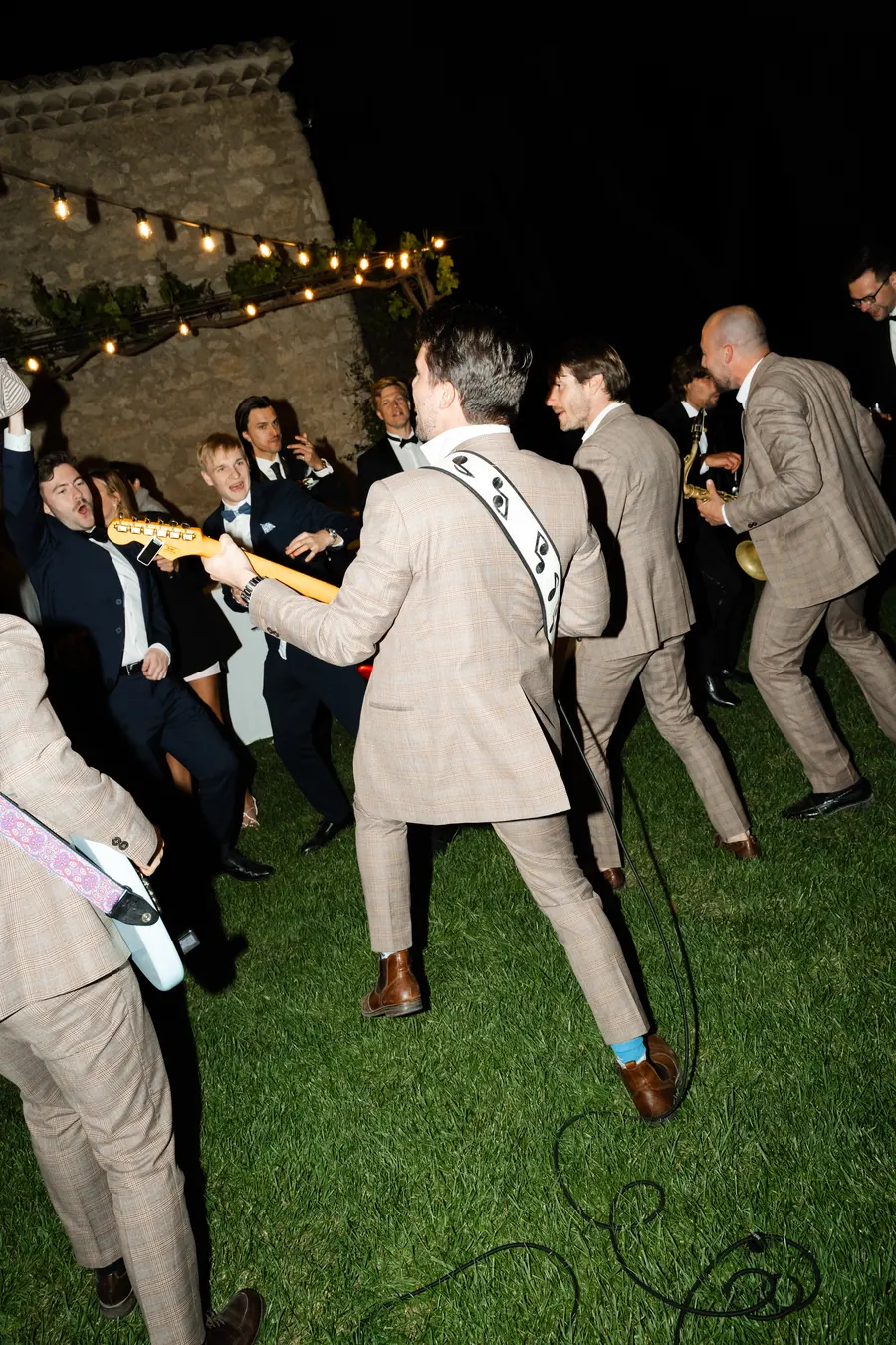 The band on a lawn at night