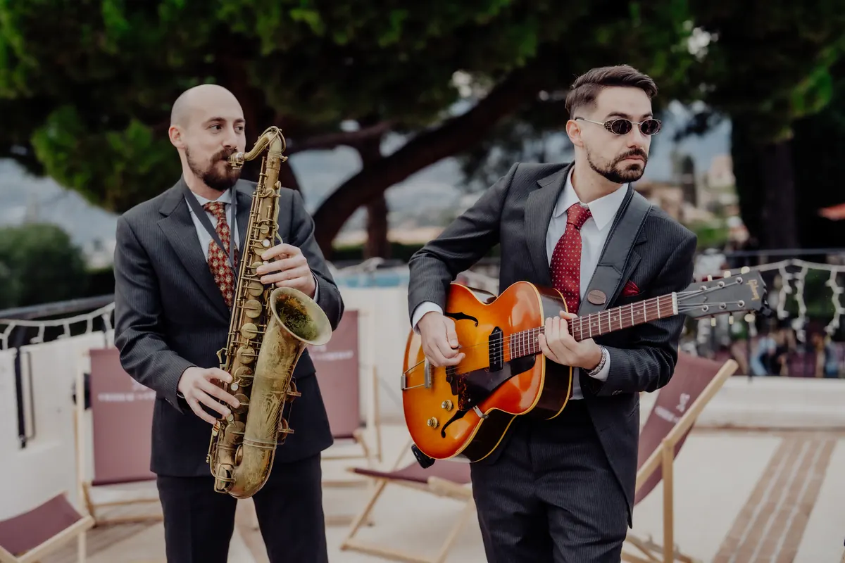 Saxophonist and guitarist at golden hour