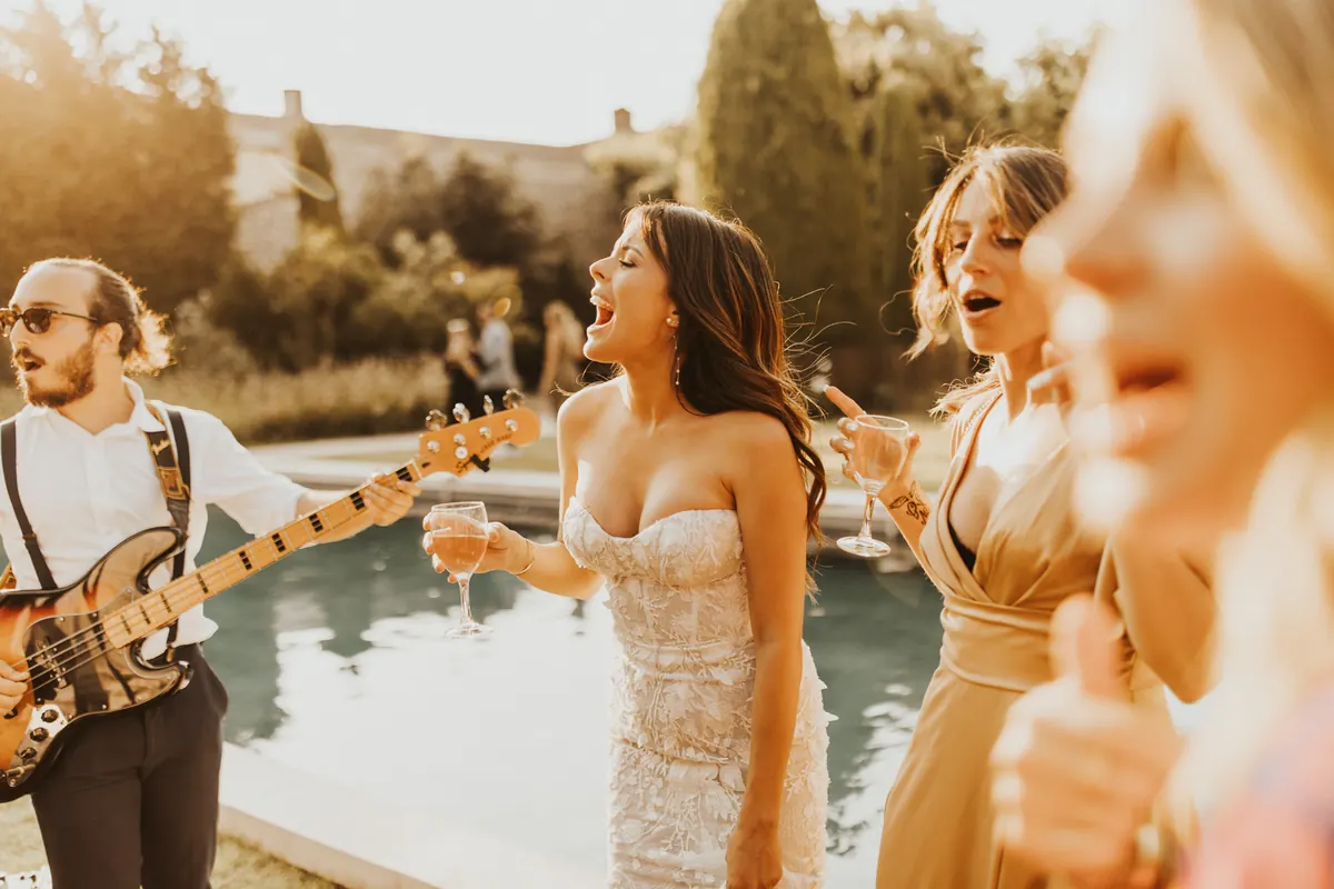 Guests dancing with the band at a night reception