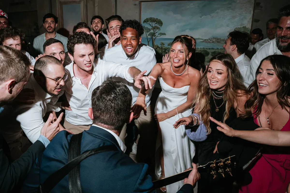 The band and guests at a black and white reception